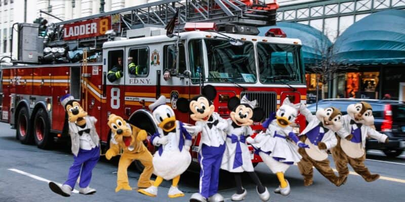 Disney characters in front of a fire truck