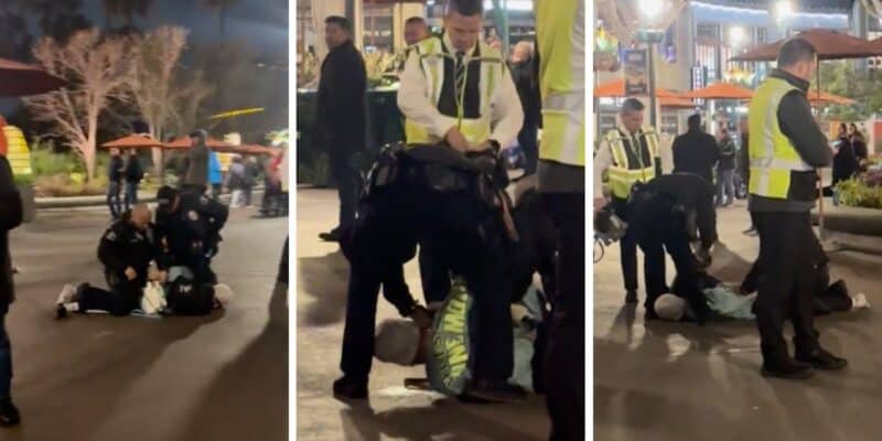 In three stills from a video, officers arrest a man for allegedly shoplifting at Downtown Disney. He is laying down.
