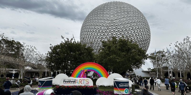 Spaceship Earth with the sign for the International Festival of the Arts in the foreground. Taken at EPCOT in Walt Disney World Resort.