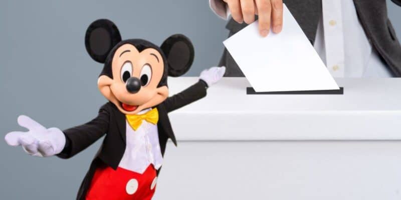Mickey Mouse in front of a voting box