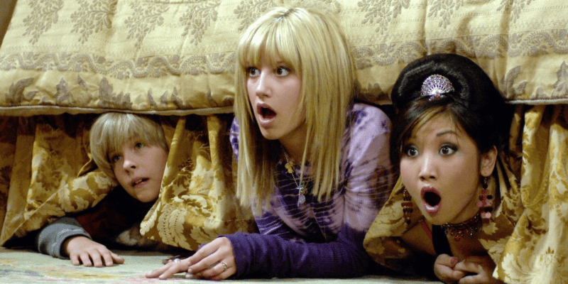 Cole Sprouse, Ashley Tisdale, and Brenda Song surprised hiding under a bed in 'The Suite Life of Zack & Cody' on Disney Channel