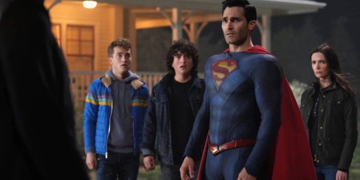 Superman, Lois Lane, and other Superman & Lois cast members looking surprised at night