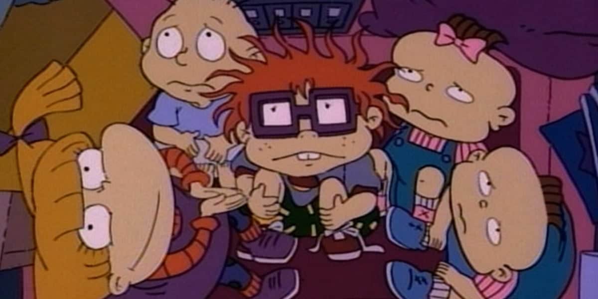 The Rugrats looking up sadly, except for Angelica, who is smiling