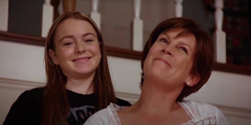 Lindsay Lohan and Jamie Lee Curtis smiling on a staircase together