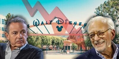 Disney CEO Bob Iger looking stressed at billionaire investor Nelson Peltz with the Walt Disney Company front gate in the background.
