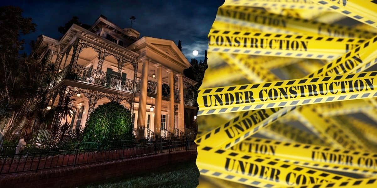 The Haunted Mansion at night in Disneyland Resort with the mysterious allure of wrought iron balconies sits in stark contrast to the bright yellow "under construction" tape, suggesting renovations or mysteries hidden within.