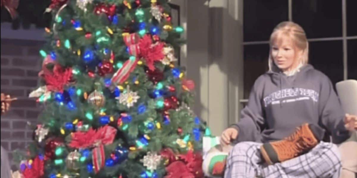 Patricia next to a Christmas tree in her updated clothing.