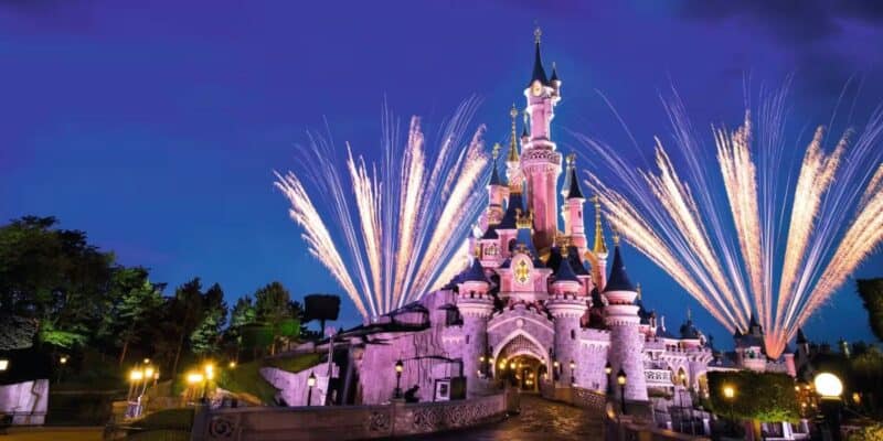 Fireworks around Sleeping Beauty Castle at Disneyland Paris at nighttime