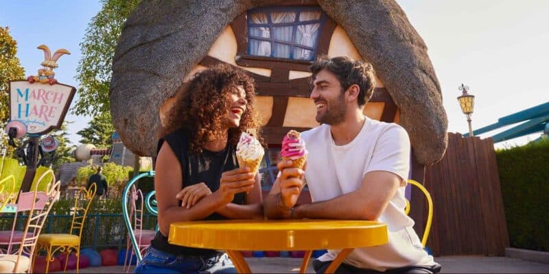 Two adults sat in Fantasyland at Disneyland Paris