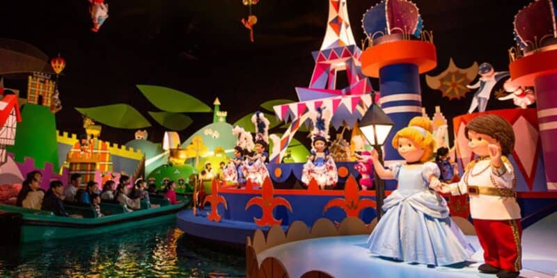 Guests enjoy a ride on "it's a small world," surrounded by colorful, animated dolls representing different cultures from around the world.