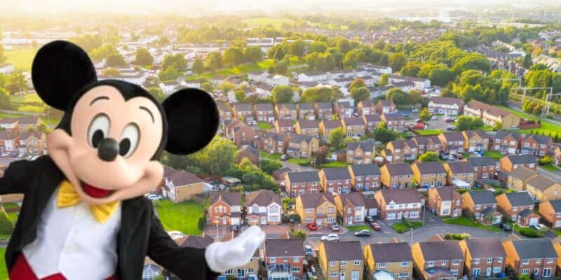 Mickey Mouse enjoys the view of a sprawling suburban landscape from above.