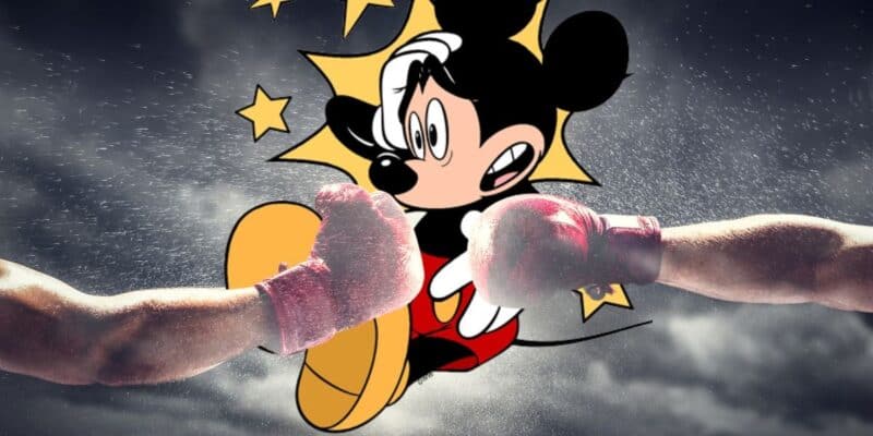 Mickey Mouse between two boxing gloves