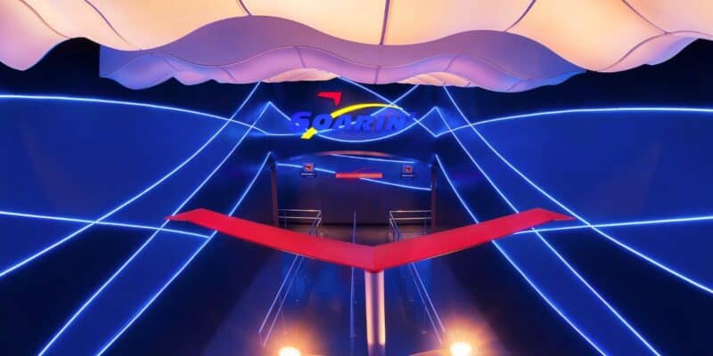 Neon lights around the entrance to the Soarin' ride.