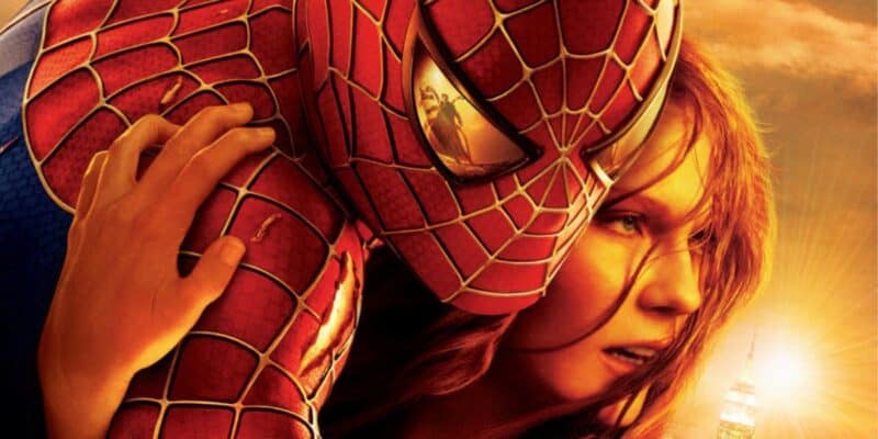 Spider-Man 2 poster with Spider-Man (left) carrying Kirsten Dunst's Mary Jane Watson (right), while Doctor Octopus/Doc Ock (Alfred Molina) is reflected in Spider-Man's eye.
