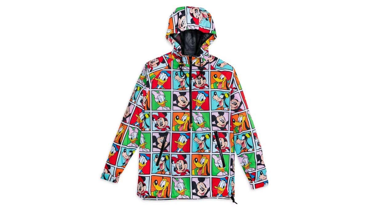 A colorful puffer jacket with a comic strip pattern featuring various cartoon characters arranged in grid panels, displayed on a white background.