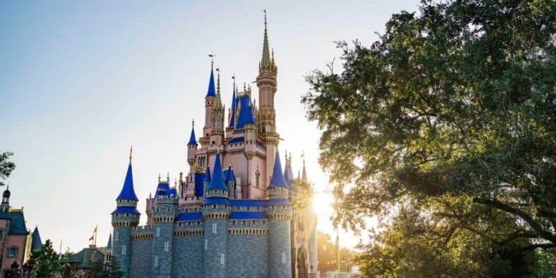 Cinderella Castle at Disney World inside of the Magic Kingdom theme park as the sun sets.