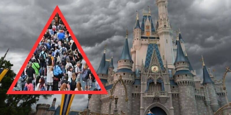 Crowds of visitors gather in front of a fairytale castle under a dramatic cloudy sky, with a red triangle superimposed over the image.