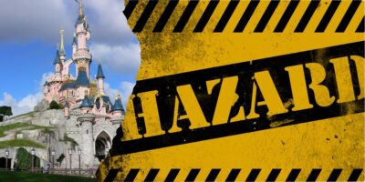 A contrasting image featuring a Disney castle with blue spires under a sunny sky on the left, and a black and yellow striped hazard sign on the right.