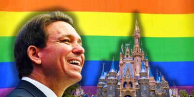 A smiling Ron DeSantis superimposed on a background featuring the Disney castle and a vibrant rainbow flag.