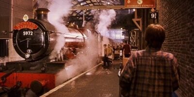 Harry Potter (Daniel Radcliffe) looking at the Hogwarts Express at Platform 9 3/4 in 'Harry Potter and the Philosopher's Stone'