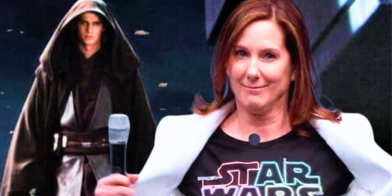 Kathleen Kennedy sitting with a microphone, wearing a star wars themed t-shirt, alongside Anakin Skywalker from the star wars universe in the background.