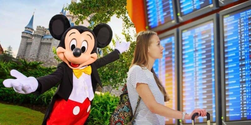 A person stands in front of a flight information board, looking up at the screen. To the left, an image of Mickey Mouse at a Disney theme park with a castle in the background adds a touch of magic to the scene.