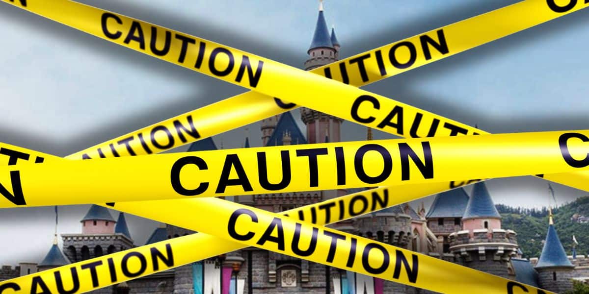 An image showing a castle behind multiple yellow "Caution" tapes crossing each other diagonally. The tapes obstruct a clear view of the castle, suggesting restricted access—much like a scene where Disney magic is temporarily off-limits.