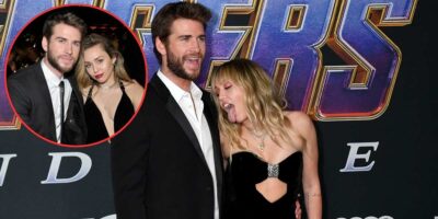 A man and a woman are posing on a red carpet in front of a promotional backdrop for "Avengers: Endgame." The woman is playfully sticking out her tongue, and they are both dressed formally. An inset circle shows a close-up of them at a different event.