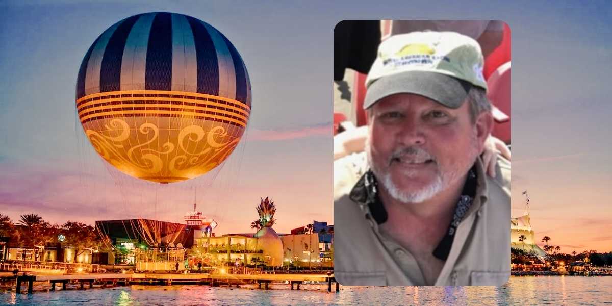 A large blue and gray hot air balloon with decorative patterns is tethered to a dock at sunset. In the foreground, there's a close-up inset photo of a smiling man wearing a light-colored cap and shirt. The background shows buildings and a calm body of water.