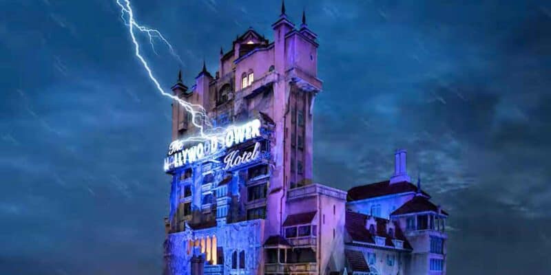 The Hollywood Tower Hotel, a fictional eerie hotel with a vintage sign illuminated against a stormy night sky at Disney World, struck by lightning.
