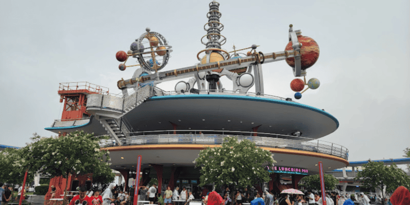 People walking through Tomorrowland at Magic Kingdom
