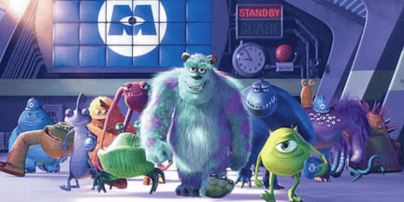 Illustration of characters from the animated movie "Monsters Inc." featuring Sulley, Mike, and other monsters in a vibrant, cartoon-style office setting.