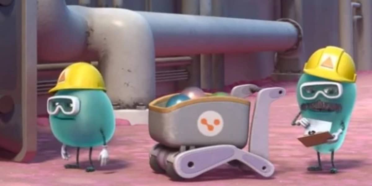 Two animated characters resembling jelly beans, equipped with construction helmets and tools, are on a factory floor, discussing plans with a clipboard and pencil.