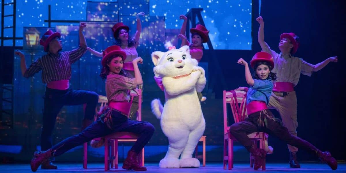 Marie from Disney's 'The Aristocats' performing on stage with several cast members for the upcoming show The Adventure of Rhythm at Shanghai Disney Resort