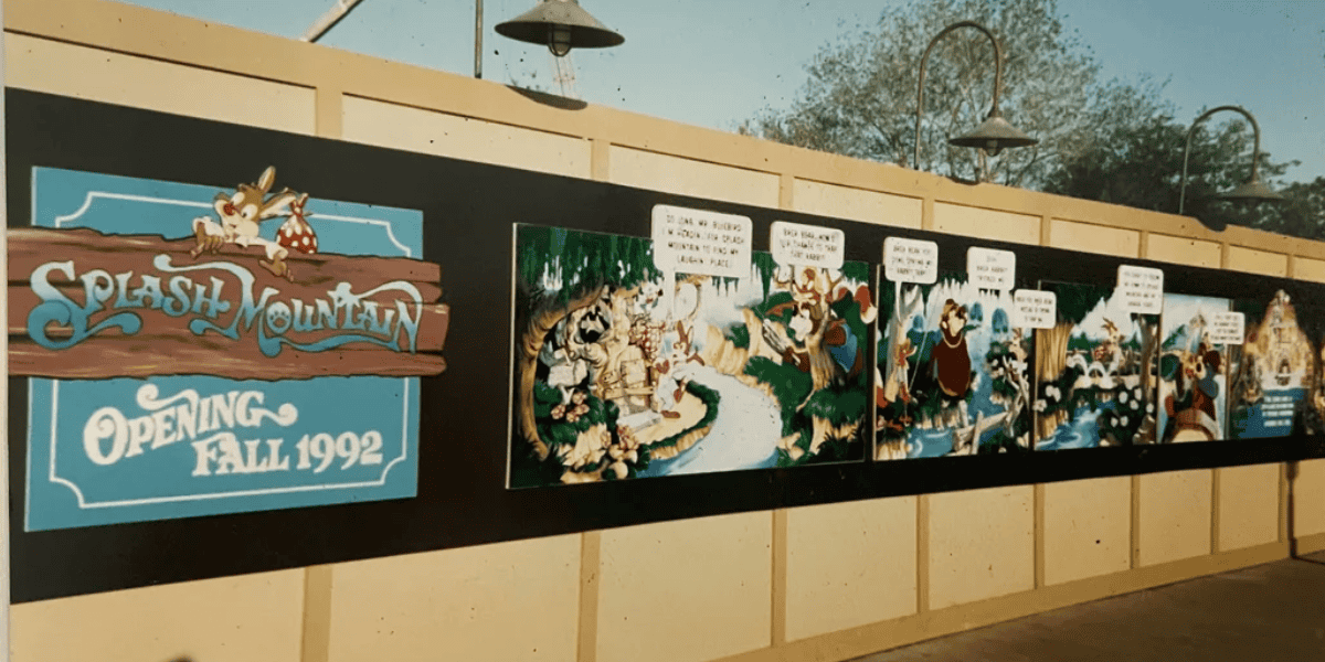 A construction wall at Magic Kingdom displays a colorful mural promoting Splash Mountain's opening in Fall 1992. The mural features cartoon scenes with anthropomorphic animals like a bear, rabbit, and fox, along with speech bubbles and a wooden sign showcasing the park's newest attraction.
