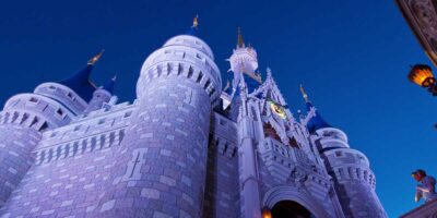 Cinderella Castle at night inside the Magic Kingdom at Disney World.