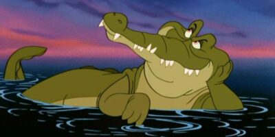 An animated crocodile lounges in water under a sunset sky, reminiscent of a serene evening at Disney World. It rests on its belly with one arm propped on the water's edge and its head tilted back, giving a relaxed, dreamy expression.