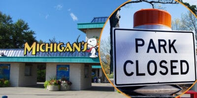 The image depicts the entrance of Michigan's Adventure, a renowned U.S. theme park, featuring Snoopy with clear skies and greenery in the background. An inset photo of a "Park Closed" sign with an orange reflector is shown on the right side of the image, hinting at an emergency shutdown or entry denied situation.
