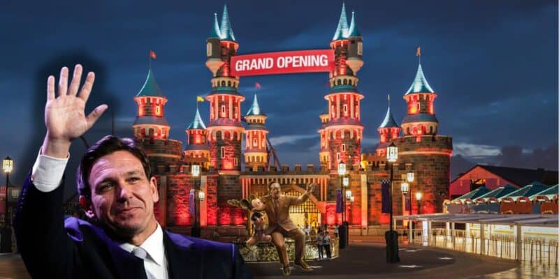 Ron DeSantis waves in front of an illuminated castle with a "Grand Opening" sign. The scene appears to be at night, with Ron DeSantis standing alongside a Walt Disney and Mickey Mouse in front of the castle.