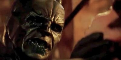 Batman (Christian Bale) sprays Scarecrow (Cillian Murphy) with his poison in 'Batman Begins'