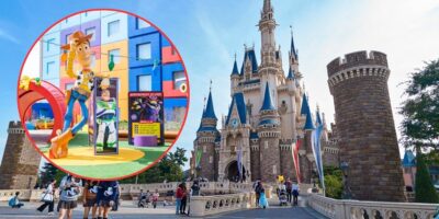 A bustling theme park features a majestic castle in the background. In the foreground, a circular inset highlights an outdoor scene with large, colorful statues of Woody and Buzz Lightyear from the movie "Toy Story," surrounded by visitors.
