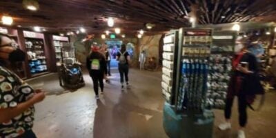 Guests walk through a store at Disney World.