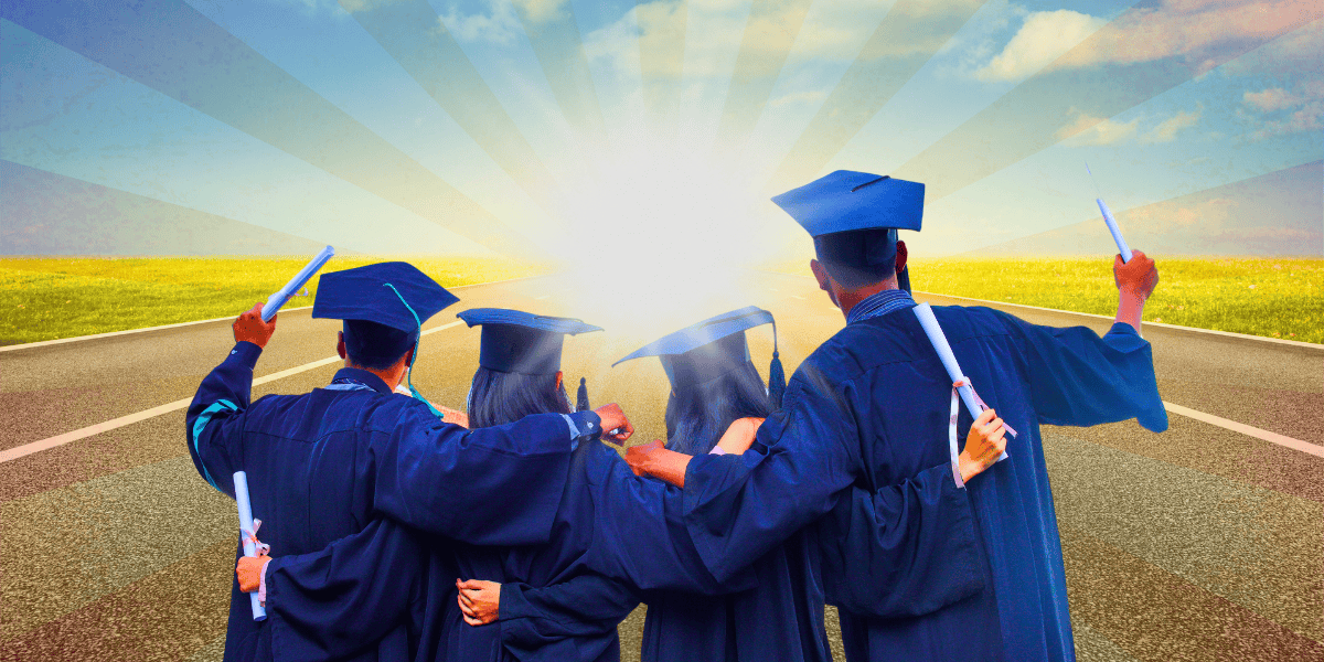 Four graduates in caps and gowns stand arm in arm, facing away from the camera towards a brightly lit horizon. They hold their diplomas, symbolizing accomplishment and a new beginning, much like contestants stepping forward after winning on "Wheel of Fortune." The background features a road and a vibrant, radiant sky.