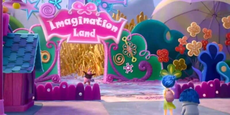 A bright, colorful theme park entrance with a sign reading "Imagination Land" in bold white letters on a pink background. Two animated characters stand near a pink fence at the entrance, reminiscent of Disney World's magic, surrounded by whimsical decorations like giant flowers and swirls.