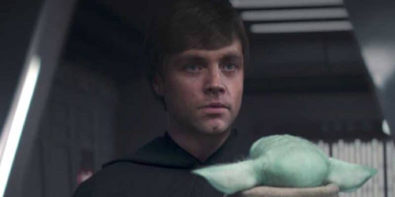 Luke Skywalker (Mark Hamill) holding Grogu in 'The Mandalorian'