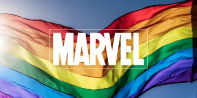 Marvel logo centered on a waving rainbow flag, symbolizing LGBTQ+ pride, set against a blue sky. The flag's colorful bands in red, orange, yellow, green, blue, and purple form the backdrop, creating a vibrant and inclusive visual.