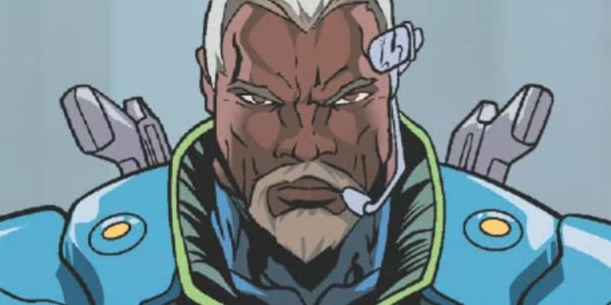 Illustration of a stern-looking cyborg with dark skin, a short white beard, and white hair. He is wearing advanced blue armor with green accents reminiscent of Captain America's patriotism, a headset with a microphone, and a high-tech eyepiece over his right eye. Two guns are mounted on his back.