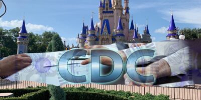 A digital collage shows the acronym "CDC" in large blue letters over Cinderella Castle at Disney World