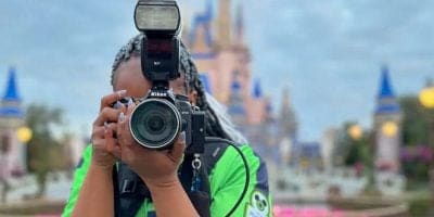 A Disney PhotoPass cast member