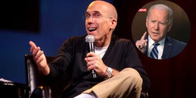 Jeffrey Katzenberg speaking into a microphone while gesturing with his hand. In a circular inset, President Joe Biden with a serious expression is holding up one finger.
